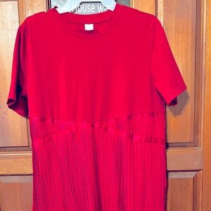 Knee length Red dress pleated at the waistline.